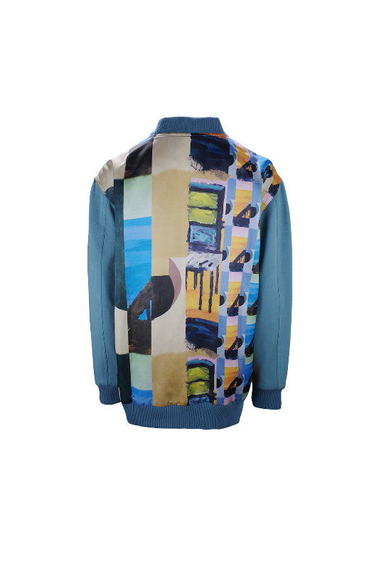Colorful abstract patterned shirt with blue sleeves on a white background