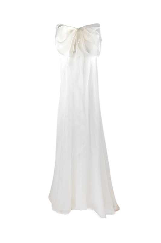 White dress with a large bow on a white background